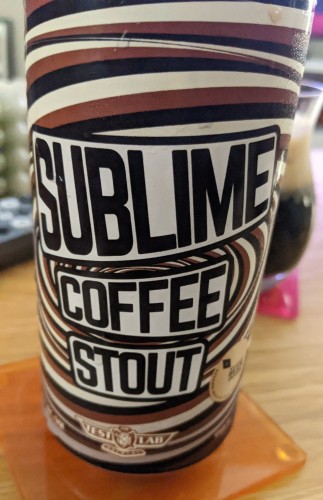 Close up of a can of Sublime coffee stout (by Test Lab Brewing) with interesting spiralling artwork.
