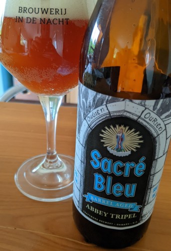 New Zealand craft beer: bottle next to glass with beer.

Sacre Bleu by Craftwork
9.5% Alc/Vol. Bottle Conditioned. 7 months old at release. Nano nana batch, 50 litres!  Vegan. Label art: Peter Davidson. Seasonal.