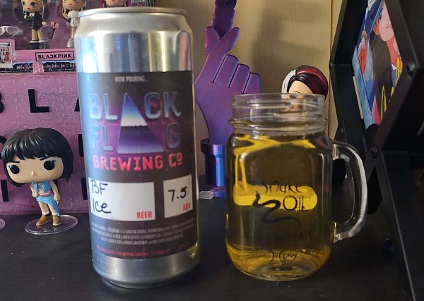 Image shows a 32oz Crowler and a mason jar like beer glass filled with beer sit on a shelf