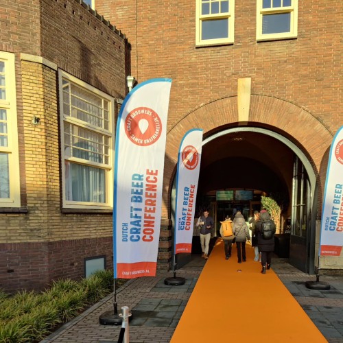 The orange carpet to the door, lined by conference flags.